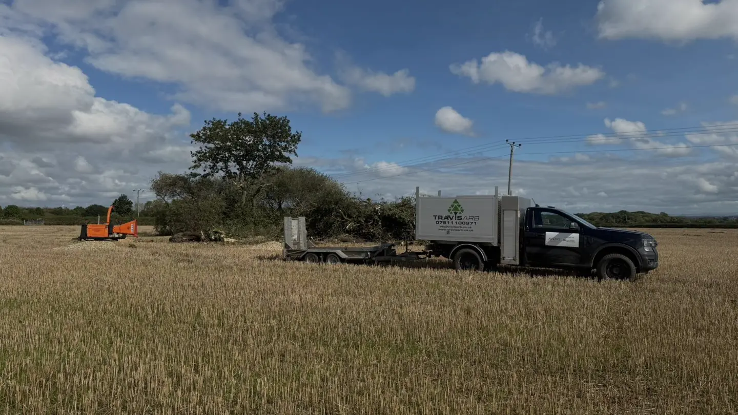 Brash being cleared and chipped in a stubble field at Bold Heath