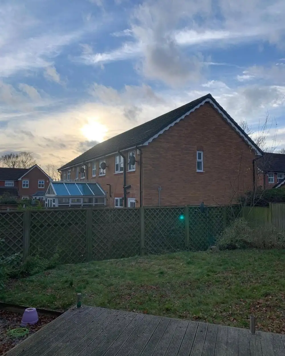 The same garden after five birches were removed and one reduced