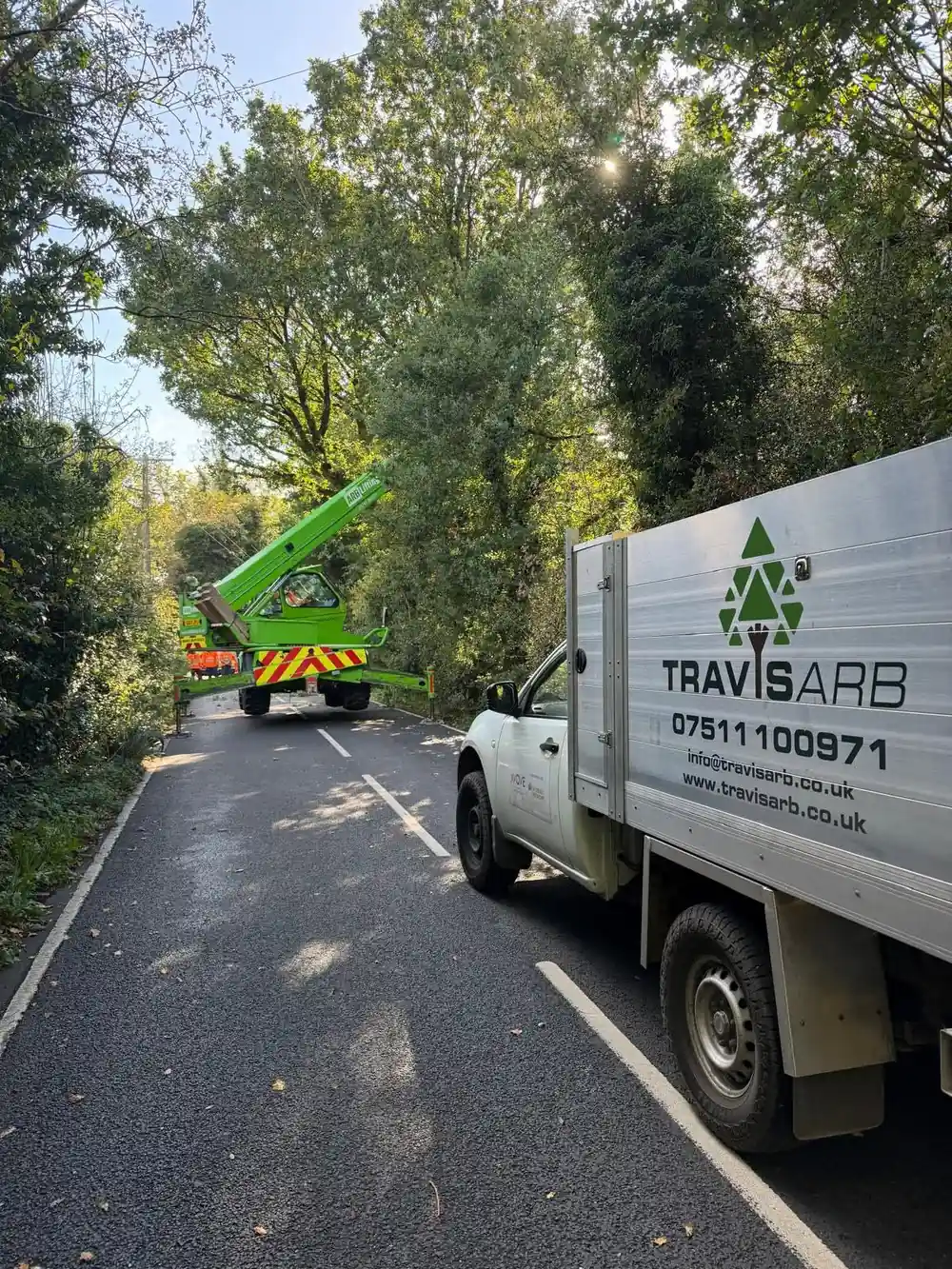 Utility contract work on a roadside at Altrincham, with the Travis Arb truck